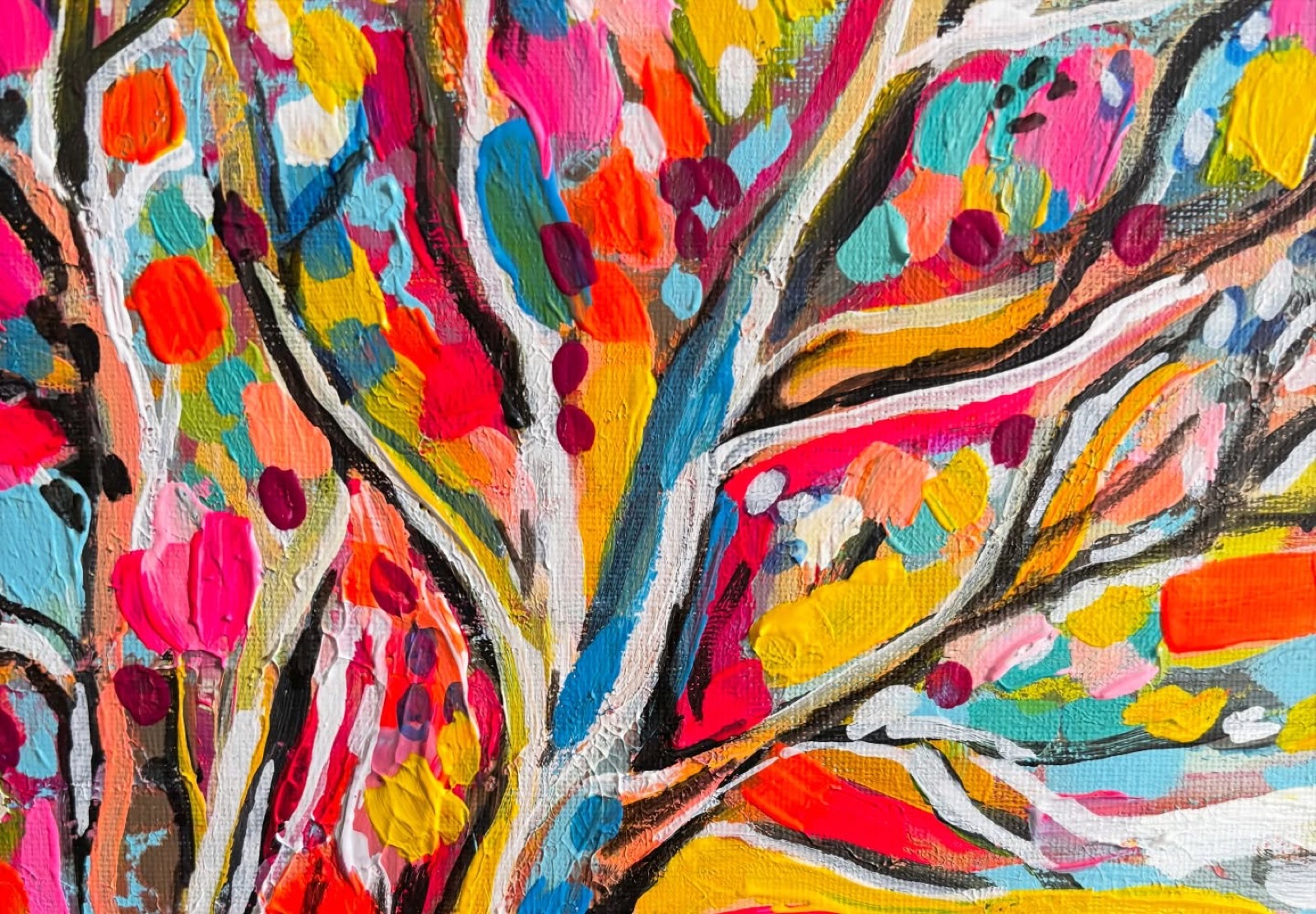 Close-up of thick acrylic paint in pink, turquoise and yellow